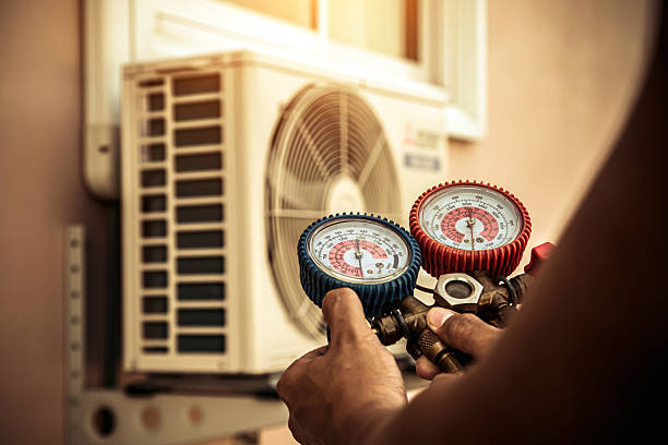 Professional Hvac technician working in Abington, MA